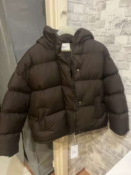 Продам пуховик новый! в Москве